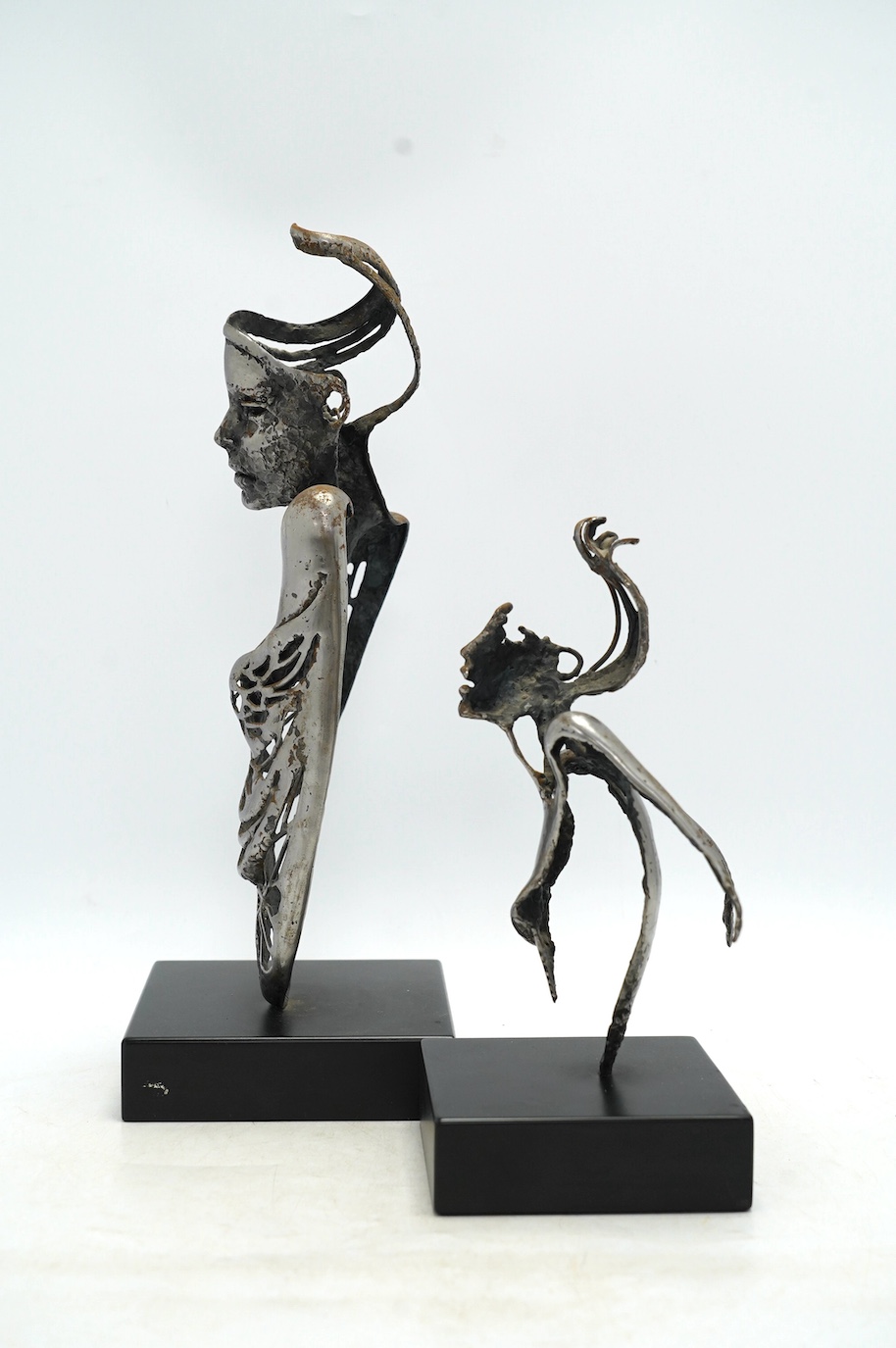 Two contemporary 'Brutalist' cast iron sculptures, initialled RI, tallest 39cm. Condition - fair to good